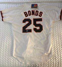 Barry bonds signed giants jersey with original tags !! PSA sticker
