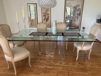 7’ x 4’ glass top dining table. Eight chairs.