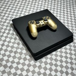 Black PS4  and Gold DualShock Controller