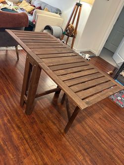 Folding wooden table