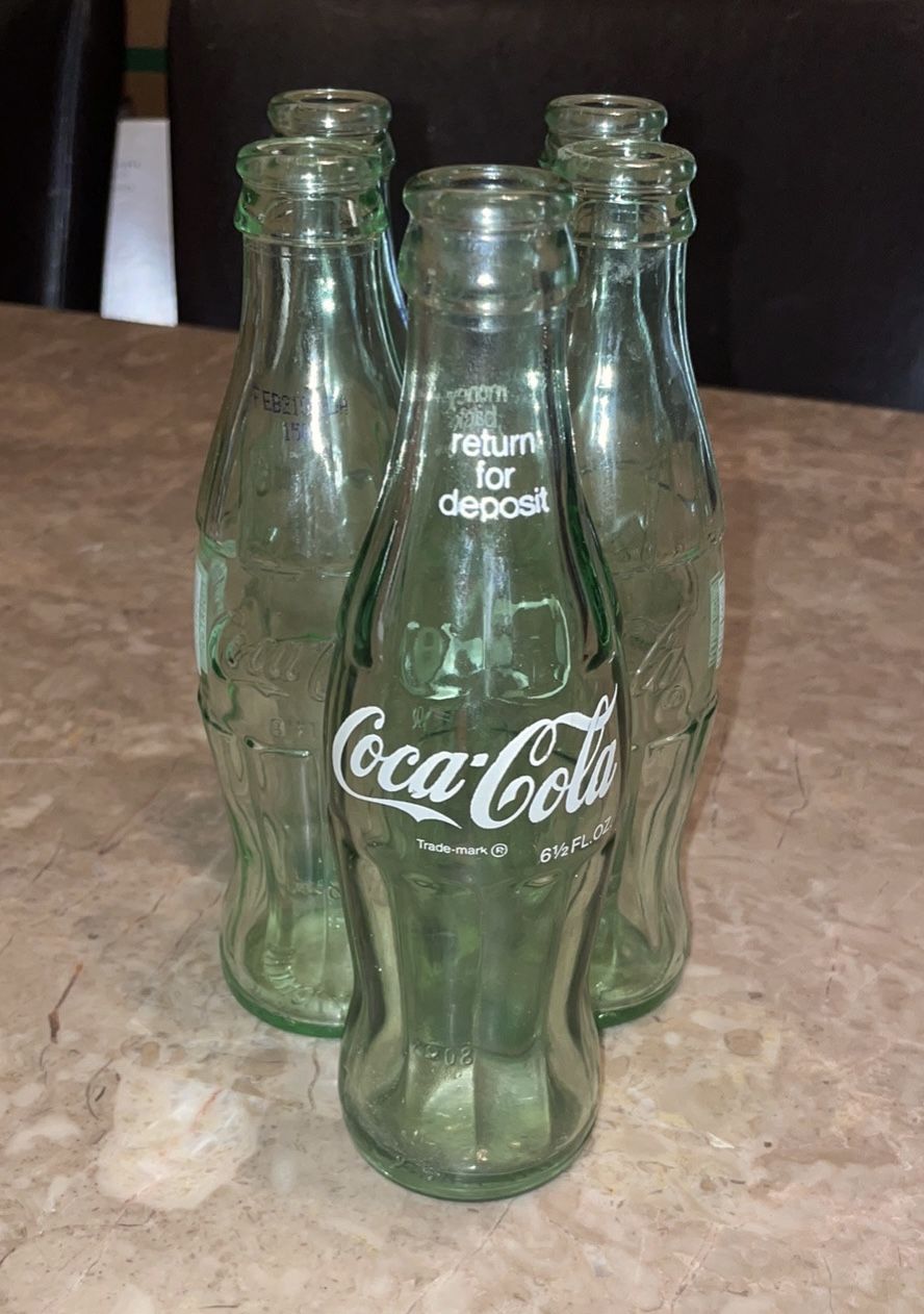 (5) Coca-Cola Bottles