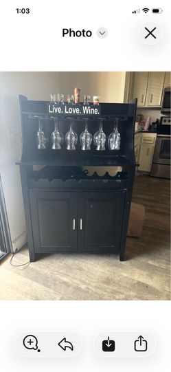 Wood Wine Rack Buffet and Storage Cabinet features a sleek black wood finish and built-in glass hold