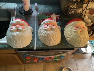 vintage molded plastic Santa Claus face designed to be used as an outdoor porch light or lamp post cover. • Design: A hollow, three-dimensional plast