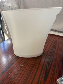 Small white garbage can