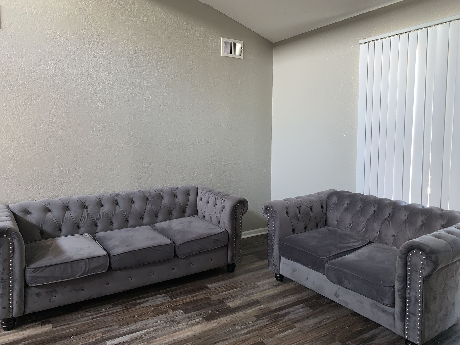2 Grey And Silver Couches