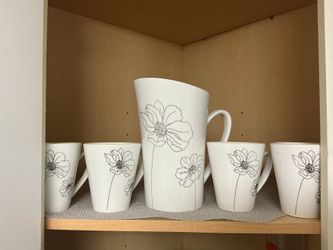 Matching cup and pitcher set