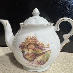 This is a Sheridan Staffordshire Finest Bone China Pheasant teapot. 