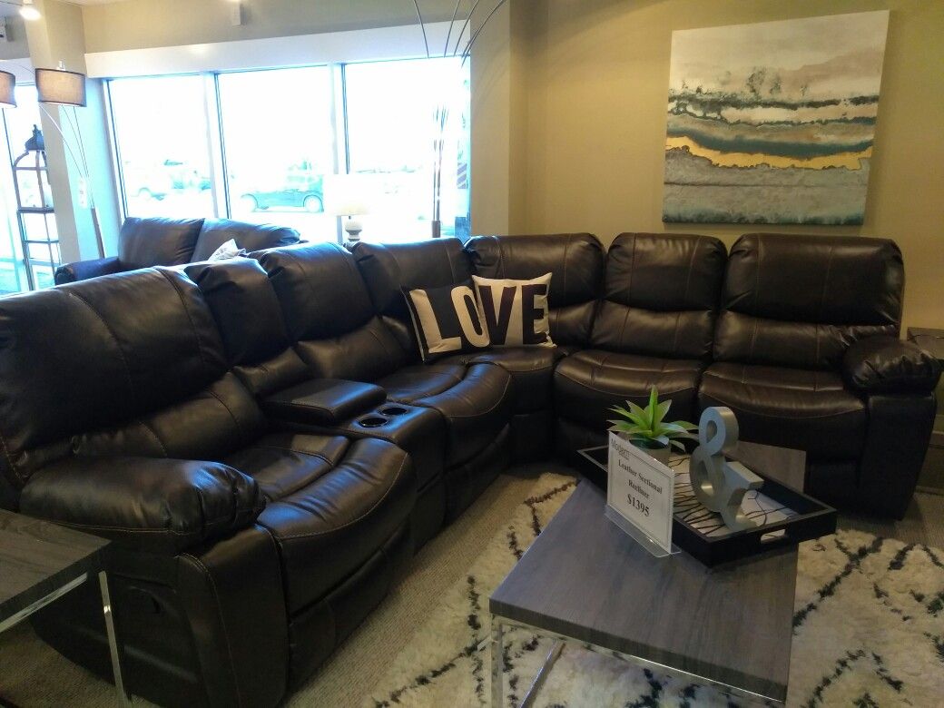 Leather Reclining sectional presented by modern home furniture in Everett