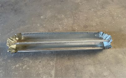 galvanized metal reel-top poultry feeder, often used for chicks or small birds