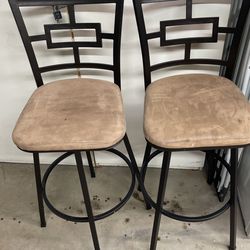 4 brown bar stools for $150