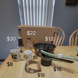 Vintage Kitchen items: Nut meat chopper, syrup pitcher, Elsie & white swan cups, dough blender, potato smasher, bundt pan
