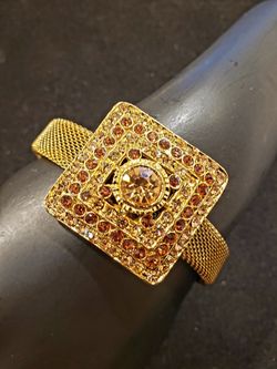 $18. Vintage antique Victorian gold plate mesh cuff bracelet with brown rhinestones.