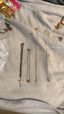 Two adult and two baby Cross necklaces
