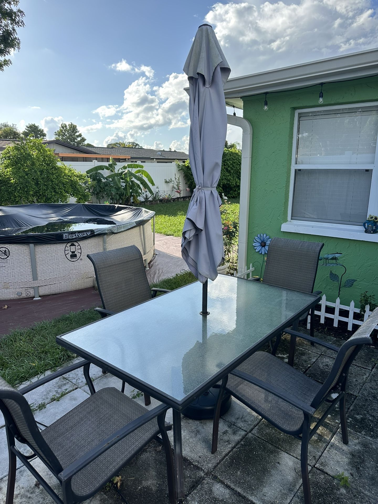 Glass Top Patuo Table & 4 Chairs , Umbrella Included