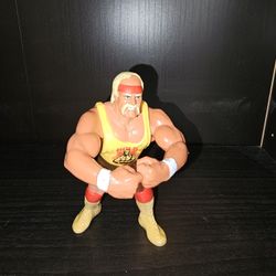 vintage 1991 Hasbro WWF Wrestling Series 2 Hulk Hogan action figure, known for its "Hulkster Hug" action feature. 