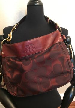 Burgundy colored Coach purse