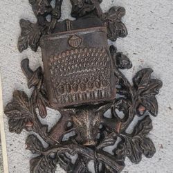 CAST IRON  VINTAGE HANGES ON WALL