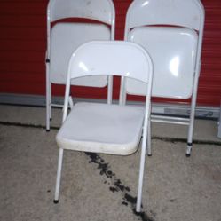 Three White Metal Folding Chairs