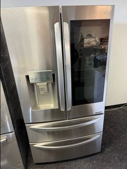 LG stainless steel French door refrigerator and bottom freezer and instaview window
