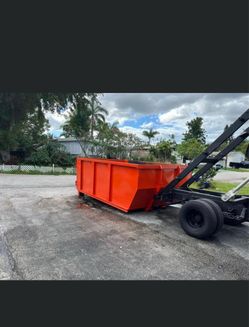 . 2013 Isuzu diesel roll-off dumpster truck with approximately 225,000 miles.