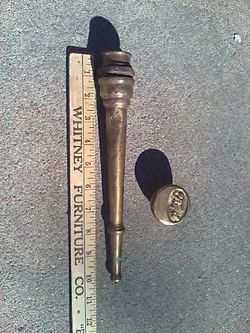 Fire hose nozzle and Ford shifter knob off Model T fire truck