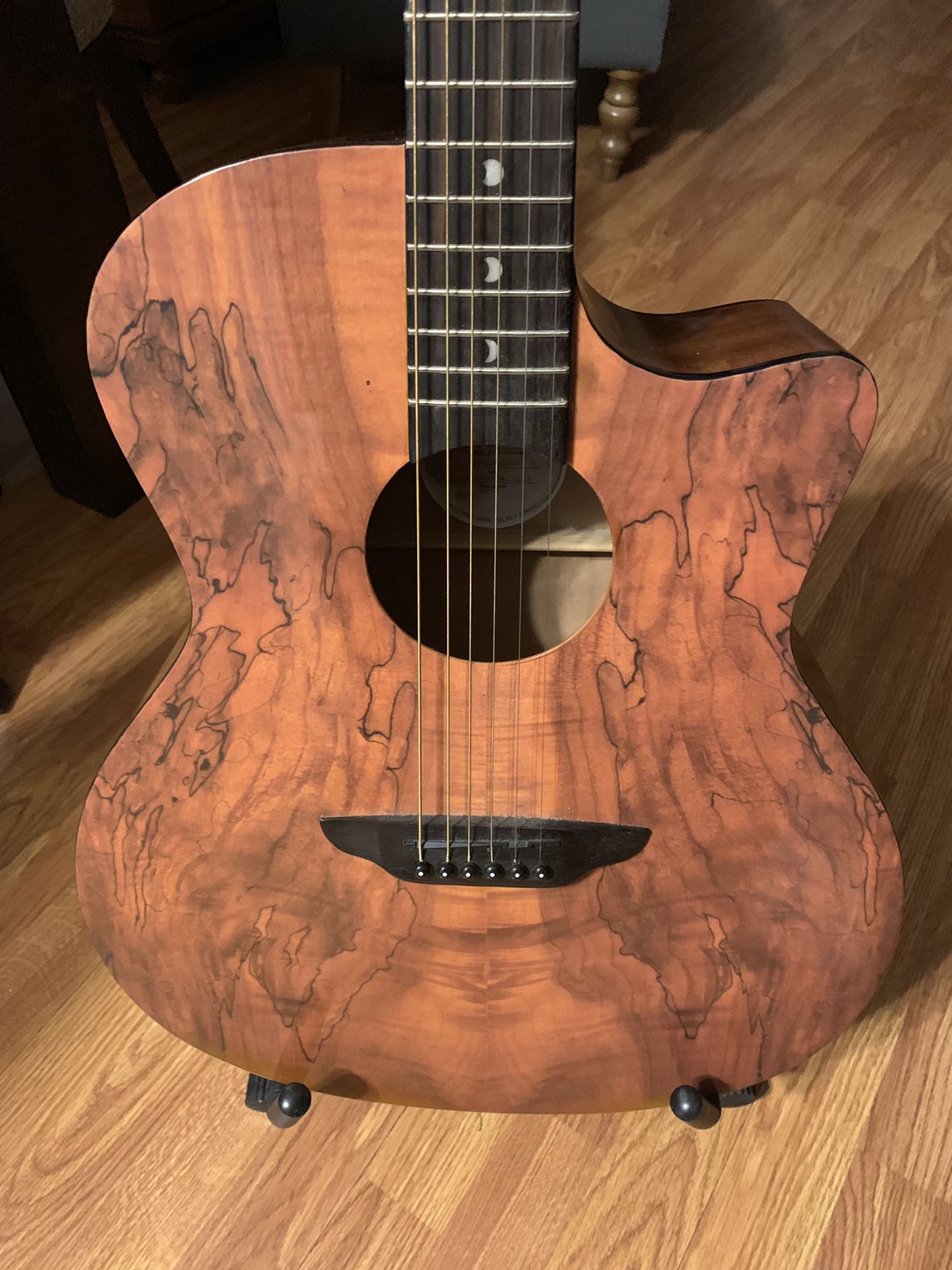 Luna guitar with mahogany back and sides.
