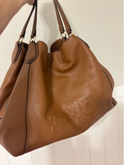 Coach Large Edie Shoulder Bag with Embossed Horse and Carriage (Style #33727) in saddle tan/brown pebbled leather.