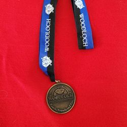 Woodloch resort 2" round medal with ribbon