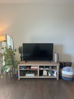Light wood colored TV stand