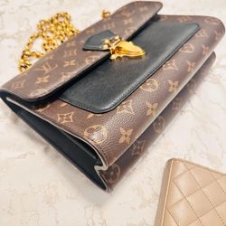 Louis Vuitton
Victoire Handbag Monogram Canvas and Leather