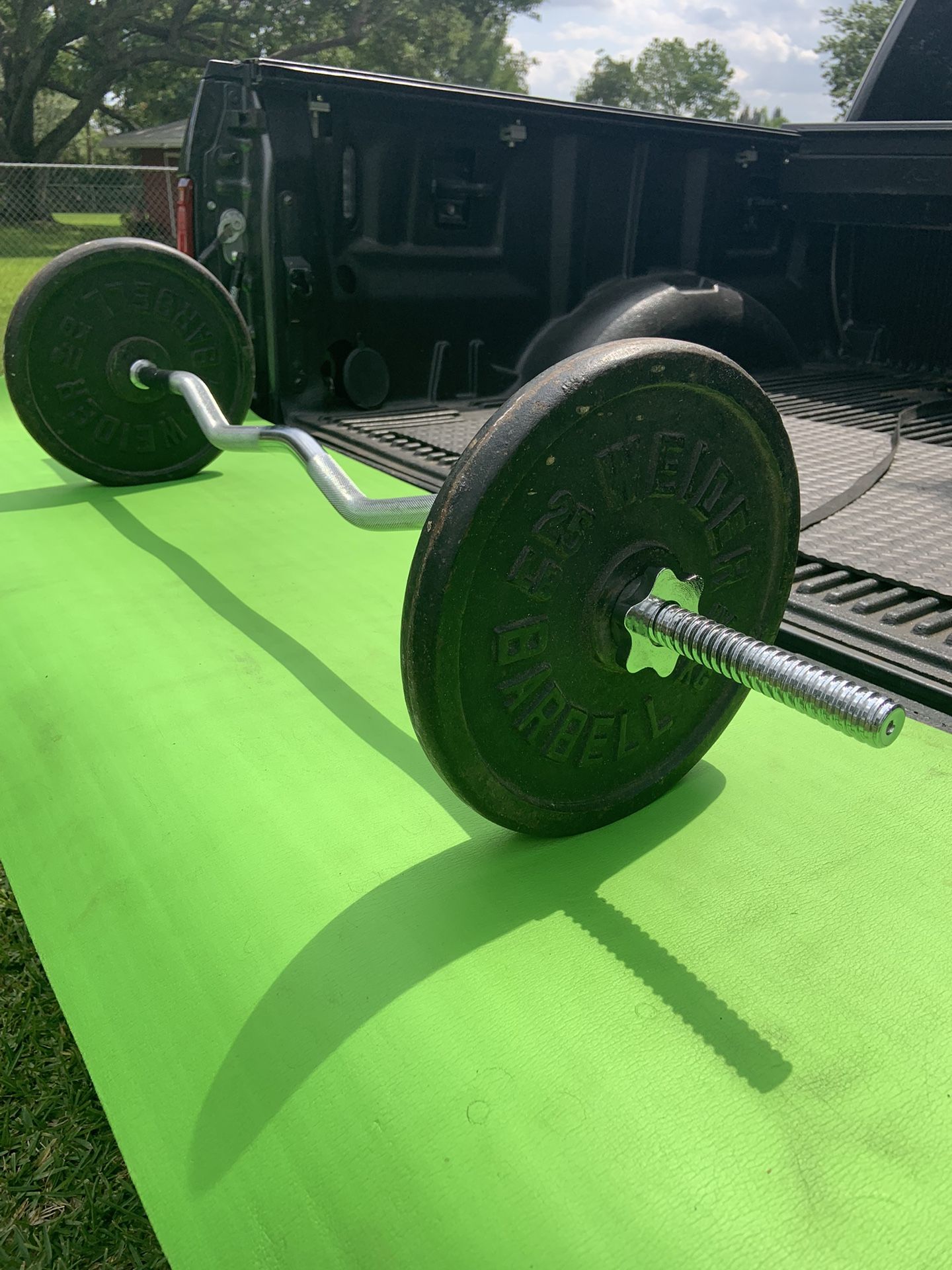 Like New Standard Curl Bar With 50 Pounds in Plates 