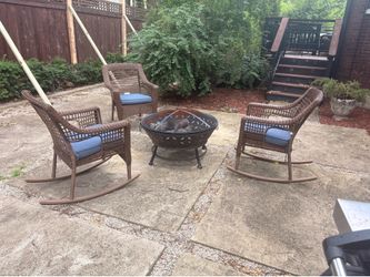 Wicker rocking chairs with fire pit