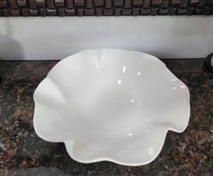 White Ruffle 16" Platter—a wide, round, decorative ceramic bowl with a ruffled rim from the Crate & Barrel White Ruffle collection.