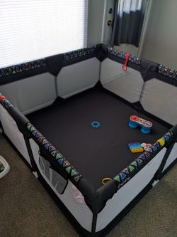 It's 59 by 59 and 27 inches tall Play Pen 