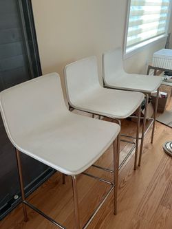 White and silver barstools or island chairs
