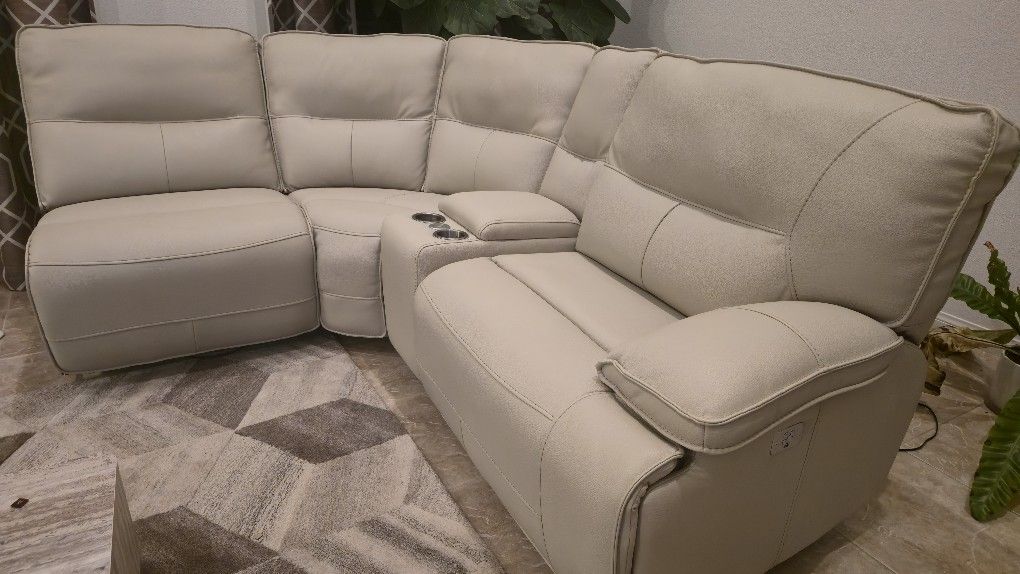 Right-Facing cream faux leather sectional.