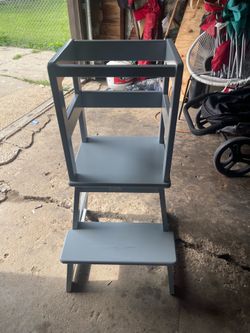 This gray wooden learning stool.