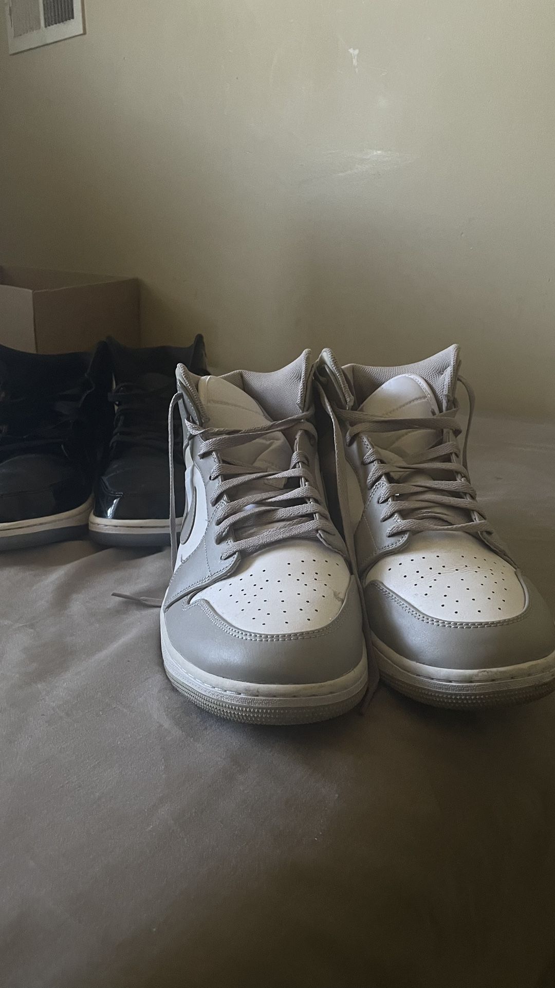 Grey and white Jordan 1 mid trainers