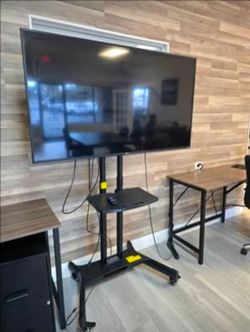 Smart TV with rolling adjustable stand