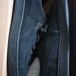 Size 10.5 Matte Black Pumas