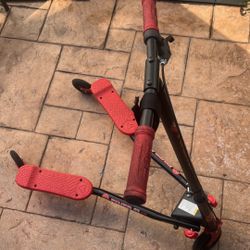 Yvolution Y Fliker A3 Air scooter. It is a self-propelling, three-wheeled scooter designed for drifting and carving.