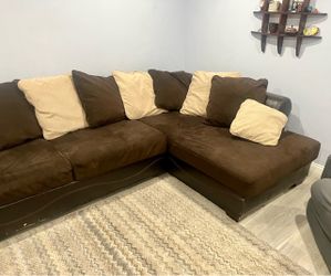 Leather couch with 8 big and 2 small back cushions