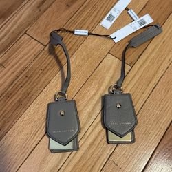 Marc Jacob’s luggage tags pair 