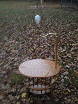 Side table with magazine holder and light fixture