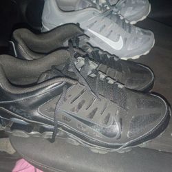 black and grey Nike reax tennis shoes