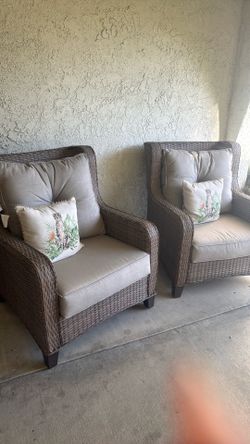 Set of two wicker outdoor chairs