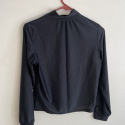 This is a dark-colored (black or dark gray) casual suit consisting of a long-sleeved top and a pair of trousers. It belongs to the athleisure or home 