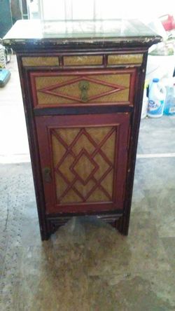 Its a beautiful Antiques project wooden stand with drawns pic are there showing & top its ceramics.