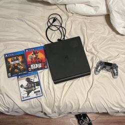 PS4 with power cable, controller and 3 games