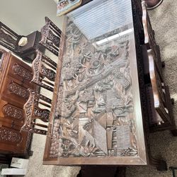 Vintage hand carved detailed Thailand village scene mahogany wood table with glass top, 8 hand carved chairs with cushions, hand carved glass/wood doo
